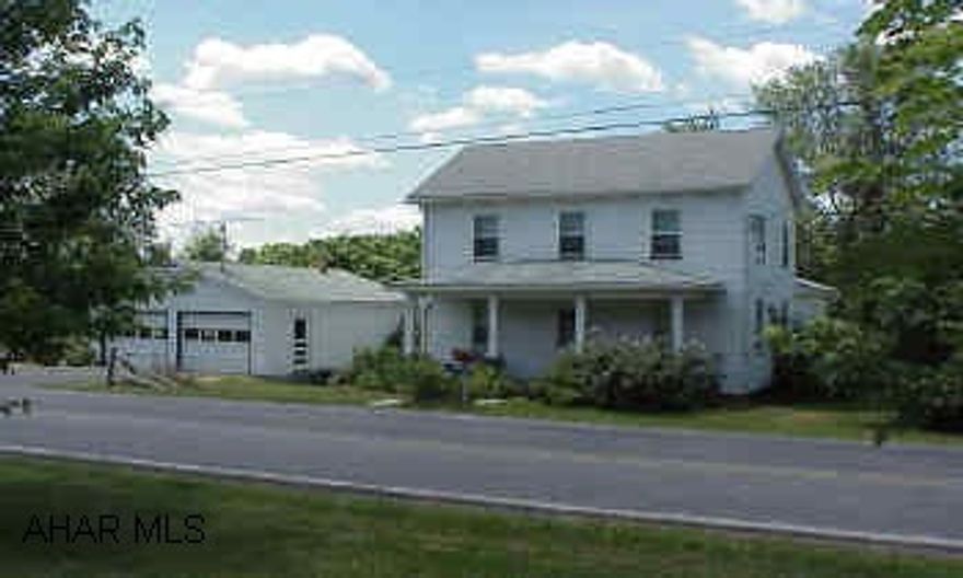 2 story farm house on approximately one acre. Lots of trees and a beautiful setting. Horses allowed. DIRECTIONS: take RT.36S. to Monastery Road-turn left. Go to stop sign..turn R. on Resevoir Road..go 1/2 mile. White house on the left w/detached 2 car garage.