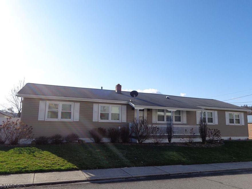 SPRING into your new beautiful home that offers convenient 1 story living on a corner lot.  Updated kitchen has cherry cabinets & granite countertop.  2 car attached garage, Sunsetter awning, whole house fan, A/C.  Newer windows, downspout & gutters, insulated vinyl siding are all with a lifetime transferable warranty.  Backyard is fenced in with a white vinyl privacy fence.  Large Family Room in Basement with Bar.  Workshop/Storage Room.  New Pergo floors.  Nicely landscaped.  Attic is accessed through the garage.