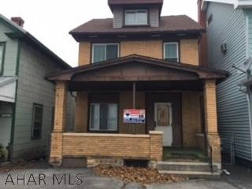 Solid brick 3 bedroom 1 bath with new laminate flooring in Living Room, Dining Room, and upstairs hallways. New hot water tank, good mechanics throughout, newer roof, large 2 car garage and fenced yard.