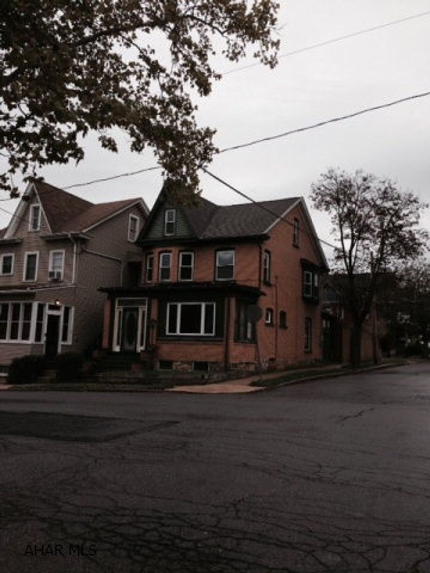 This is solid brick home features orginal woodwork dual staircases, hardwood floors and a very quaint garden/patio area. Completely fenced for privacy on a corner lot with a newly remodeled bath and being prepared for a fresh painting. New roof and windows throughout. This could be a true show place with a little attention to detail. 1 Year Home Warrenty included!!