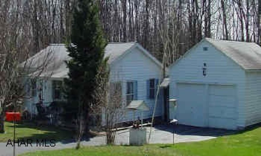 Lovely 3 bedroom 1 bath home, with 2 ar garage, sun porch and heated workshop on .39 acres. Lovely 3 bedroom 1 bath home, with 2 ar garage, sun porch and heated workshop on .39 acres.