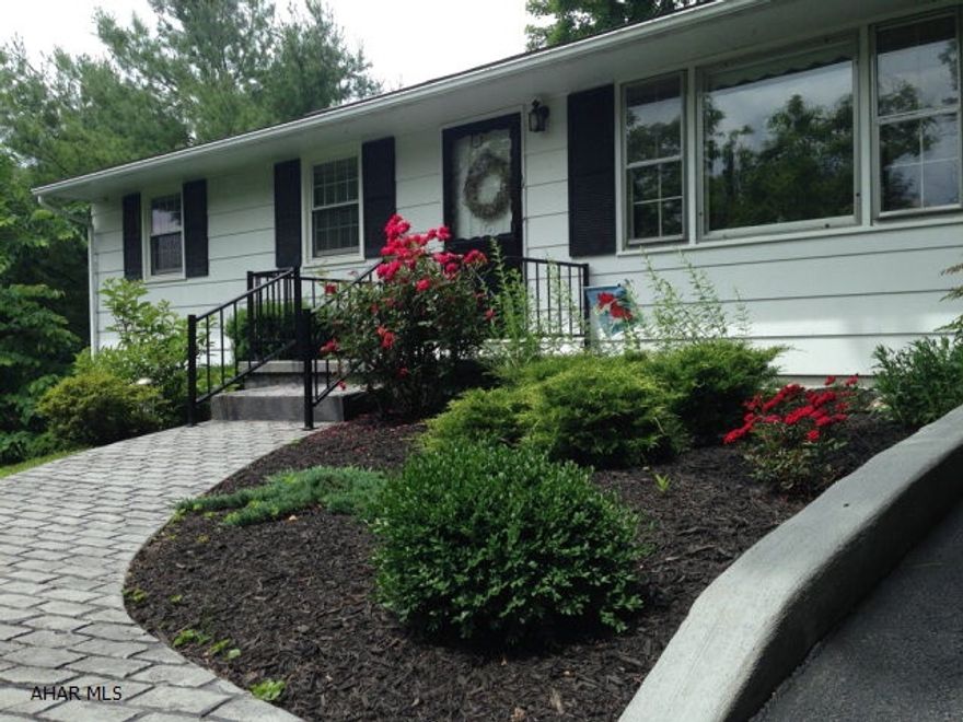 Nature is part of the experience when living in this wonderfully maintained bright and sunny 3 bedroom, 1 and a half bath ranch home. New heating/central air conditioning, windows, professional landscaping and the newly decorated designer feel is bound to please. Upon entry, one is immediately drawn to the beautiful views that surround the home. A large screened in porch found just off the kitchen area is at the heart of this lovely home. From the sounds of birds and the sight of deer and wild turkey that frequent the back yard, it is hard to believe the home is just minutes from town. The sunny bright feel continues in the lower level where a wall of windows bath the additional sunny bedroom/office area.