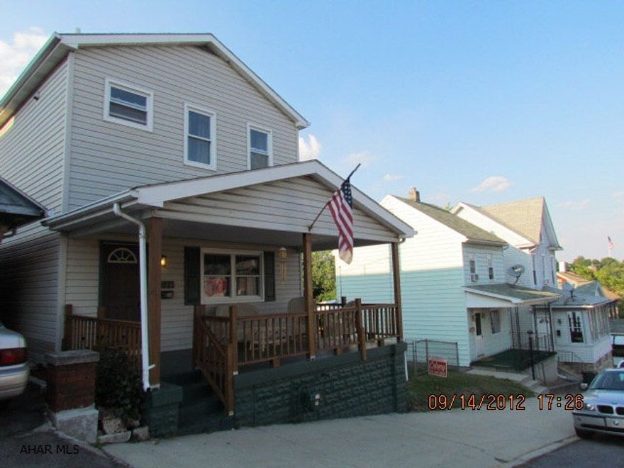 Must see!!!! Enjoy your morning cup of coffee with a fabulous view of the city. This home boasts newer red oak floors, ceramic tile and oak kitchen with tile backsplash. The private backporch is enclosed and heated .... perfect for a small exercise room! The rear deck allows you to watch your pets and children play in the double lot. Parking is no problem with an oversized 2-car carport and off-street parking. Less than a block to a new playground. Priced to sell. Realtor Owned.