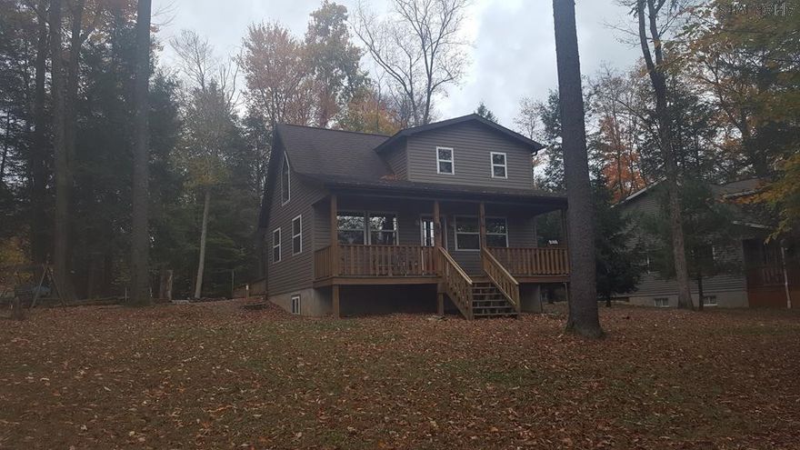 Perfect getaway cabin located on 2 lots in Glendale Yearound!!! With 2 more lots across the street for a total of 4 lots and 1.2 acres. 1 bedroom and 1 bath on second floor. Living room and kitchen on the main floor. Partially finished basement has family room or possibly a bedroom along with laundry and half bath. Attached garage conveniently accesses the main floor or the basement. Glendale Yearound is a gated community only minutes from Glendale Lake and Prince Gallitzin State Park. Community pool, basketball, tennis, security, and more.