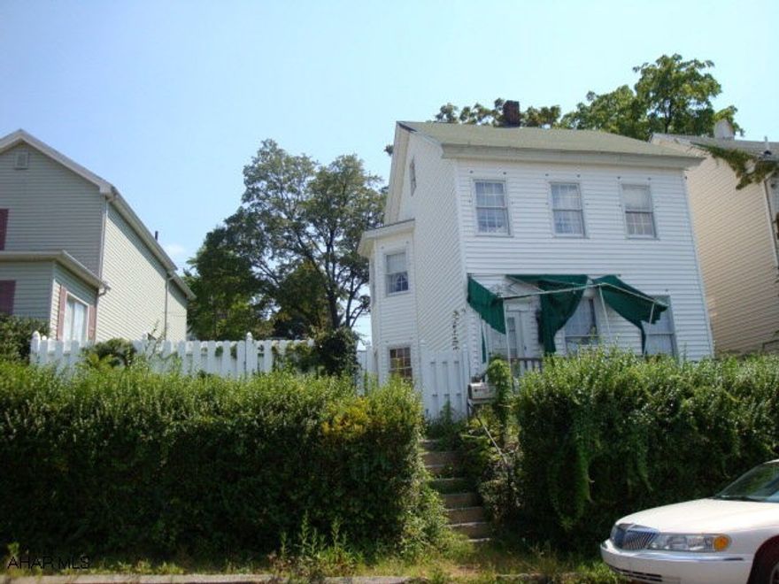 Property being sold as is.  Buyer must pay 2% transfer tax. Handyman's special, vinyl siding, 3 BR, 1 BA, fenced yard, double lot (2021-23 2nd Avenue).