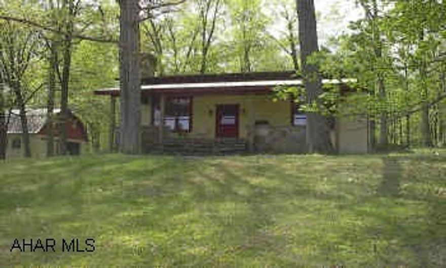 48.2 acres, Borders State Game Lands.  Call for Survey Map.  Possible Delayed Possession.  Exterior is Block/Wood Siding.  Heating Type is Hot Water/Baseboard.  Driveway is Gravel/Black Top.  100 amp electric system. TAKING BACK-UP OFFERS UNTIL FULL MORTGAGE COMMITMENT IS RECEIVEDUnique 3 bedroom home on beautiful flat, wooded acreage.  Privacy at it's best.From Frankstown - past Rolling Hills @ Degol Intersection turn left, Continue 2.9 miles turn right @ church onto Shaw Rd, Continue 1.2 miles, Look for Mailboxes on right, Turn right onto Quiet Hollow Rd, Go .2 mile turn right at Remax Sign. Property begins here. Follow Lane to House.