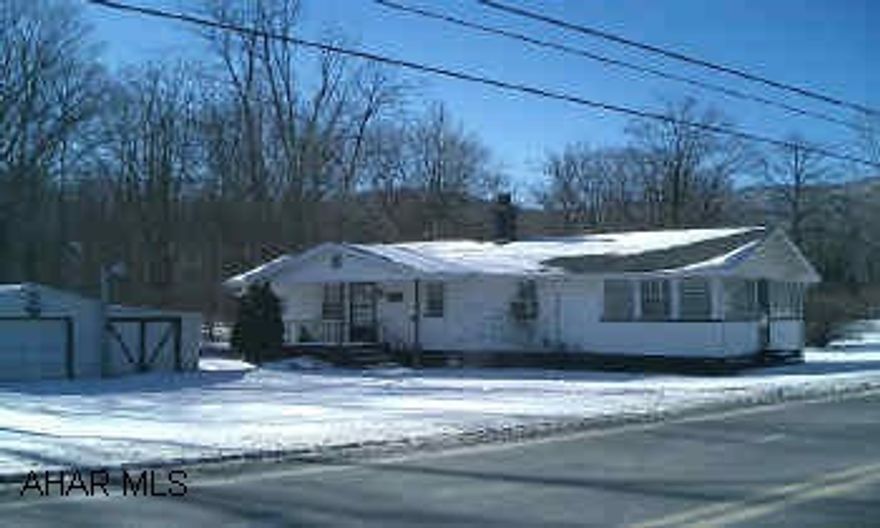 Cute cottage - property goes beyond stream. NO SHOWINGS UNTIL JANUARY 31st.