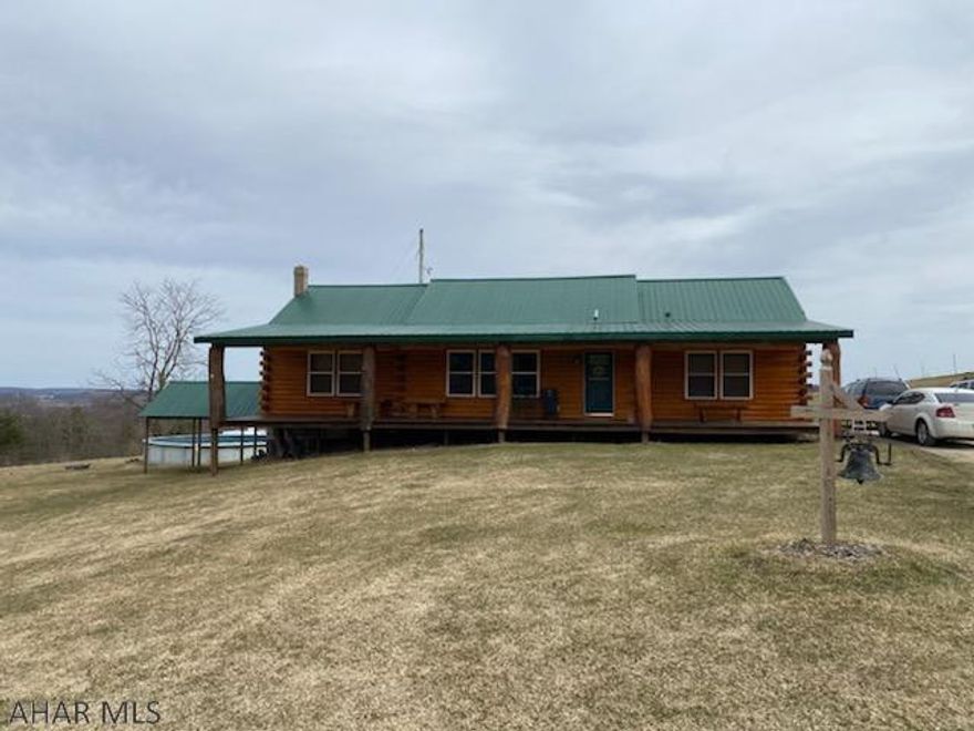 Log sided modular rancher on 10 acres in a nice country setting. The home features 3 bedrooms and 2 baths, dining area off the kitchen, living room with fireplace and large basement family room.  7 stall horse barn with pasture areas and a large pole building that needs some finishing. Private setting.