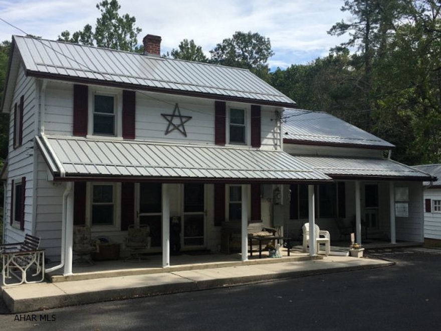 Country tranquility less than a mile from town! Property located on nicely landscaped 3 acres, directly across from State Game Lands. 4 beds, 2.5 baths with in-law suite. Spacious with finished basement including second kitchen and walk out. Back yard has park like setting including above ground pool with handicap accessible deck, mulched sitting area and stream access. Dry basement, property is graded for water drainage around house. Newer roof and facia. Whole house generator. Multiple out buildings including 40'x 60' pole barn with giant overhead door. Pole building has frost free water system, exhaust fams, separate electric system and wood burner. 12'x14' garage and additional shed as well! So much to offer, set up your showing today!