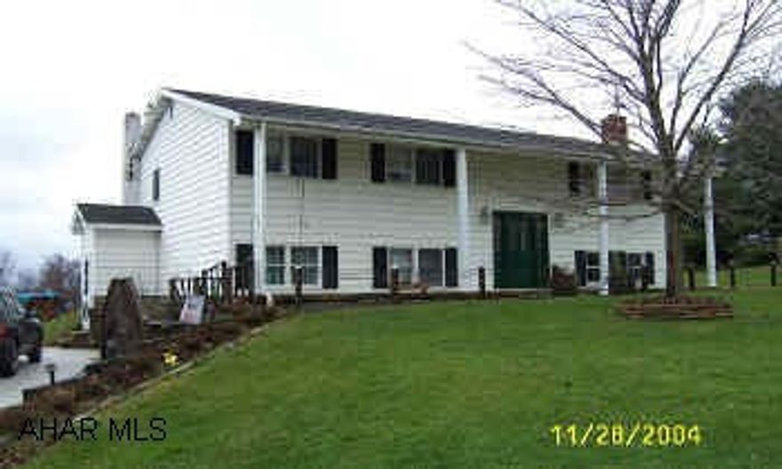 split-entry with garage and small barn. garage-30'x36', barn 24'x32' with a finished loft.