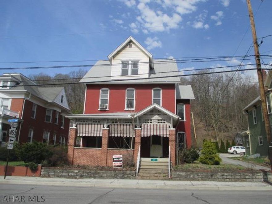 Large brick 2.5 story Tyrone home in need of TLC. LArge detached 2 car garage. Handyman special. AS-IS sale. Seller will make no repairs.