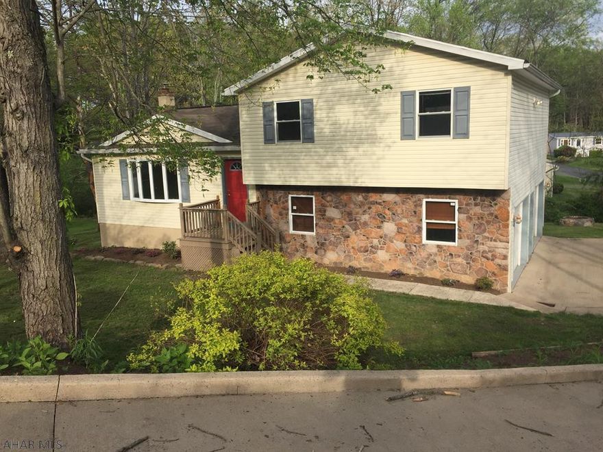 Open main level floor plan. Hardwood floors throughout main level. New appliances including upstairs washer and dryer.  Three carpeted bedrooms upstairs each with large closest with closet organizer. Large deck off dining room/kitchen. Two car garage, heated and insulated. Quiet neighborhood. Woodward Elementary School in Keystone Central School District.  Home is agent owned.