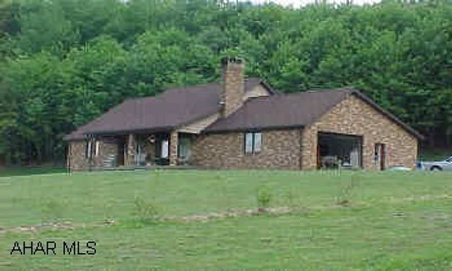 1 1/2 story, brick and shake home, 12 yrs old on 7 acres of beautiful land. Owner has recently had extensive natural oak woodworking completed in the home. Beautiful oak fireplace front. Cathedral ceiling with oak beams. The second floor has no carpet. sale subject to owner finding suitable housing. Spring fed water supply is located on the adjacent property over 300' from home. This supply has not needed treatment and has been unfailing in supply. There are two springs on the subject site that are not used.