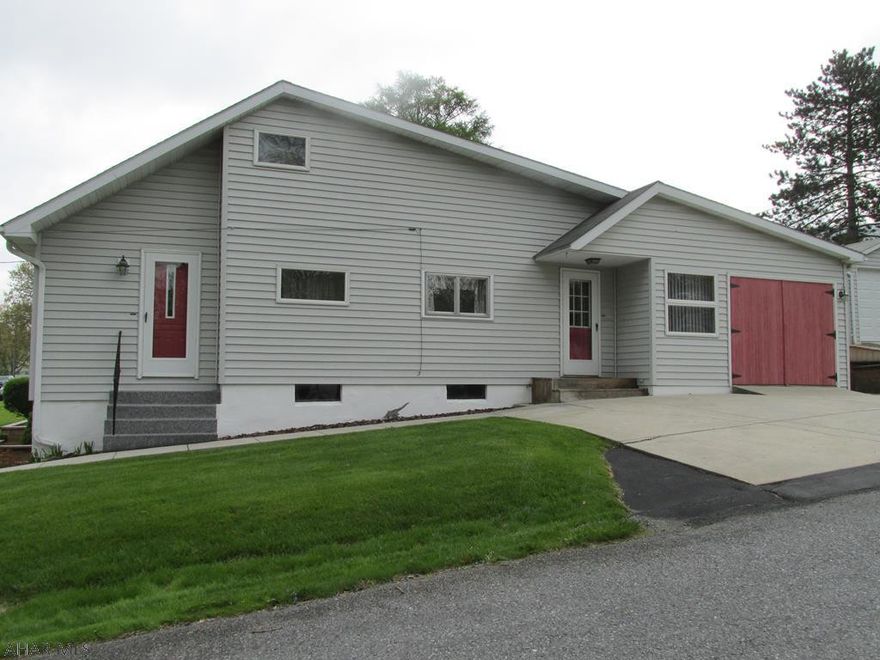 Unique Story & half home in Logan Twp.  Low taxes, Maintenance free exterior 4-5BR, Eat-In Kitchen, 2BA, 3 one Car garages, Gas hot water heat, w/ space wall units for air conditioning.  100 AMP Breaker panel, All appliances included, Flat screen TV in Master included, Furniture in second fl BR included, loads of storage and well insulated.  Perfect starter home!  Sold "As Is