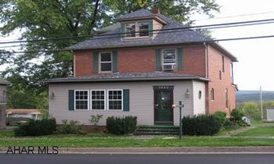 Historic 2.5 story brick home, 4BR/2BA, lavish sun room, original oak trim, elegant foyer, pocket doors, hardwood floors and original built-in cupboards in dining room and kitchen. Finished 3rd floor bedroom. Huge walk-out basement with workshop. 2nd floor balcony with view.