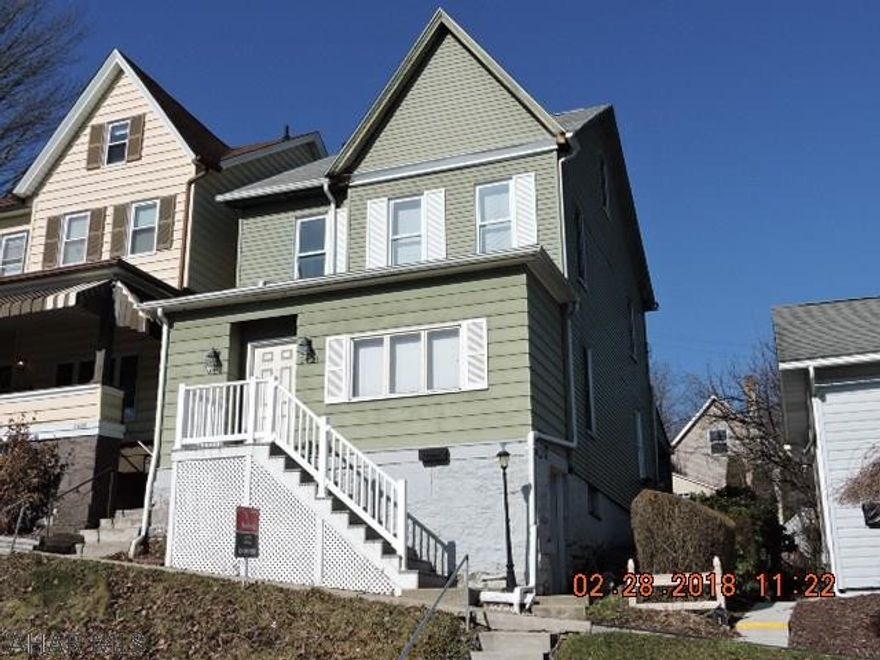 Nice 3 or 4 BR with modern kitchen and appliances, formal dining room, and large rear covered patio.  Oak floors on first floors ready for finishing, or seller will consider carpet allowance to qualified buyer.  Hot water heat makes it warm and cozy.  A little work will make this a great home!