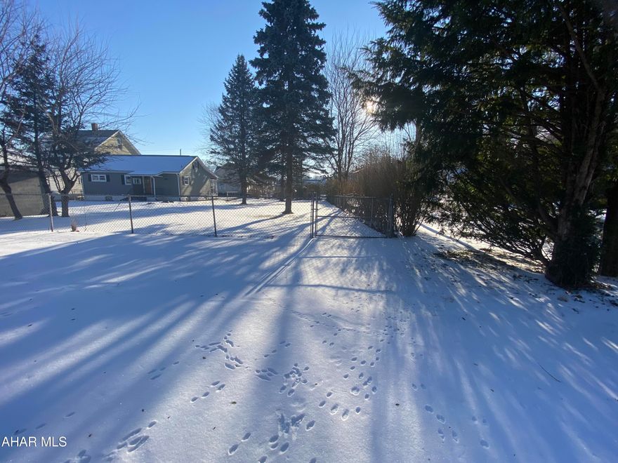 Build the exact home to suite your needs in the AASD on a flat lot, in a quiet neighborhood. The empty lot is tucked away in the Toy Town area with a blacktop driveway, fence, and mature trees to offer some privacy.