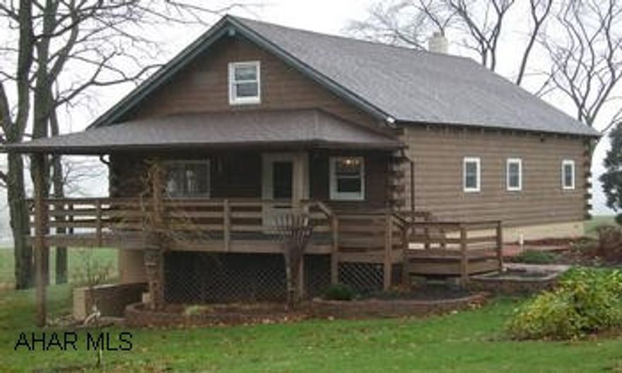 Peaceful Private Setting - 1.7 Ac. Log Home - Detached 2 Car Garage W / Loft Above - Additional Coal / Woodburner Country Setting - Great Log Home - Hardwood Floors - Loft Work / Office Area - Beautiful Pecan Kitchen W / Appliances - Trex Deck - Central Air - Newer Roof & Windows - 2nd Kitchen In Basement