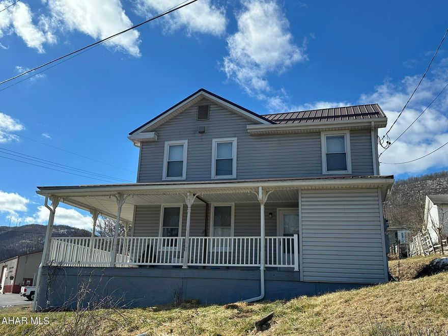 Nice looking home with beautiful views in Everett borough. Two bedroom with possible third on main floor and 1.5 baths. Large open concept living and dining area. Kitchen with glass door walk-out to back porch. Main floor laundry. Oil forced air heat. Updated electric. New metal roof in approximately 2015. Central air unit is on site just needs hooked up. Private rear parking, beautiful wrap around porch and just enough back yard space! Set up your showing today!