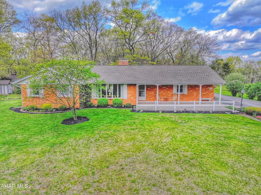 Lovely Brick Ranch home with 1.68 acres. This home has been lovingly cared for. One level living including laundry with washer and dryer. Two Bedrooms and 2 Baths. Large living room with inviting wood fireplace. Bonus room that could be a third bedroom or office. Basement is partially finished has a Family room with woodstove and a pool table that is included. Old cook stove in working condition in basement,  Heating is a heat  pump and also has central air. Outside there is a beautiful yard just freshly mulched , stunning blooming trees and a comfortable front porch to sit and enjoy the outdoors. Attached one car garage and detached shed. Furniture left in home is negotiable. House is located off Ritchey Rd onto Berks Rd. Call to get an appointment to make this your home!