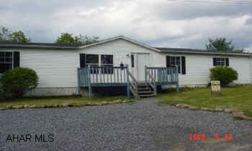 Location, Location, Location!!!    This Logan Township 3BD  2 Bath doublewide sits on very nice private lot in a great location. Needs a little TLC but has great potential.  Totally fenced in lot (approx. 1/3 acre owned not rented), 2 story shed with electric, fire-pit, basketball court and more.  Must see to appreciate. Motivated Seller!!  Call Debby Gottberg for more information at 931-2997.