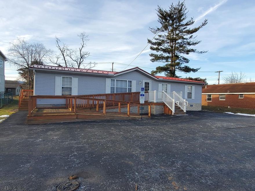Double wide currently used as office with off street paved parking and handicap accessible.