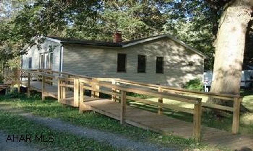 One story home w/ newer floor covering and NEW roof (30 yr guarantee). New front deck and side ramp. Level lot. Shown by appointment.  Maintained 1-story home with newer floor covering, freshly painted and plumbed for 1/2 bath off foyer.  New front deck and side ramp.  Level lot.  Close to all amenities.  (Directions:  From Bedford take I-99 north to exit 3, turn left onto Rt. 56 west approximately 6 miles, right onto Reed Road, right onto Wayne Blvd. 1 +/- mile house on left.)