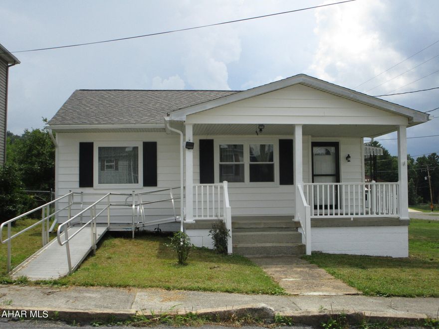 One floor living, not too big, not too small, just right.  Two bedrooms, one bath, living room and kitchen.  Full unfinished basement allows you room for storage or a family room.  Handicap access.  This home is near the city but not in the middle of the fray.  Well with city sewer.  Oil hot air heat.  New flooring and paint.  Newer roof, windows, and bathroom.  Great for downsizing or starting out.