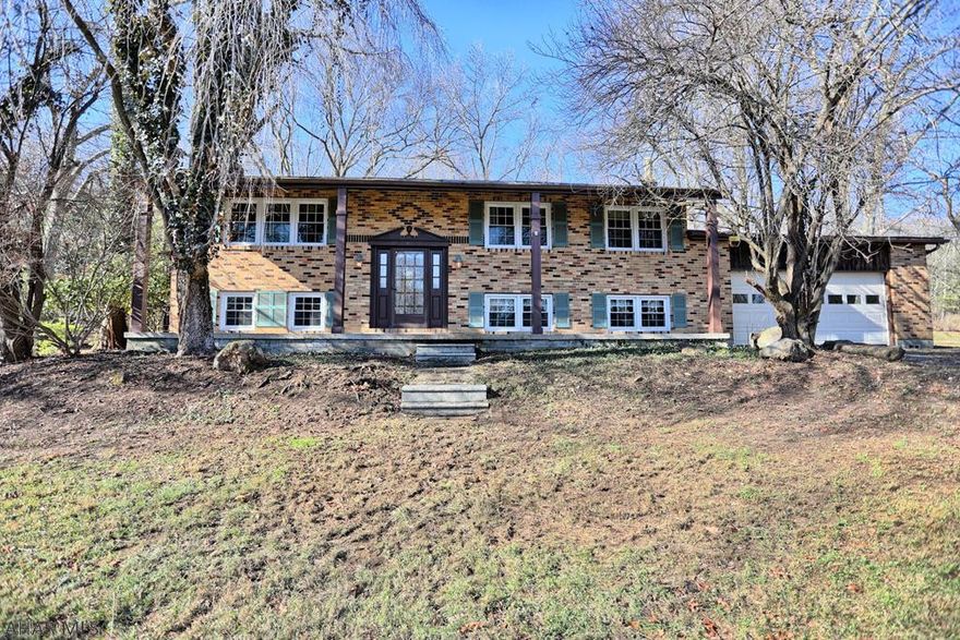 Check out this beautiful Warrior's Mark Property!  The home is located on 5 acres that you can enjoy from your deck and large 3 season porch.  You can enjoy your 40x80 shop/garage.  The shop can park 8-15 vehicles!  The home also has three bedrooms, 2.5 bathrooms, and large living area.  The home features 2 fireplaces in house and one in garage.  It has an additional pipe for a wood burning stove in basement that is not currently being used.The basement has large family room, game room and extra kitchen (easily converted into a in-law suite) that enters into a two car-attached garage.  Schedule your appointment today!