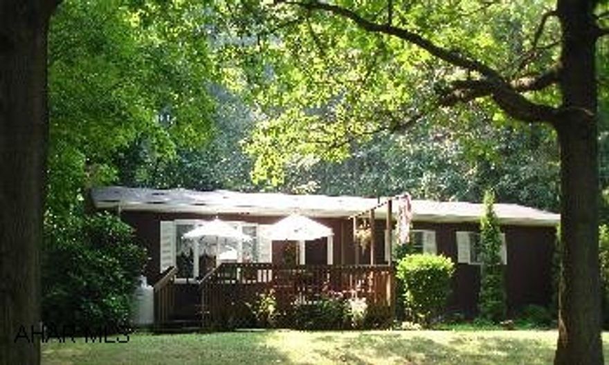 Three BR, 1.25 BA Ranch, Oak Kitchen, Family room in basement with propane stove.  Screened in back porch, 2 car detached garage.  7 YR+/- Roof.  Beautiful country setting on 5.02 Acres. After hours call Patty @ 696-3213 or 932-3672 to show. This ranch home sets on 5.02 acres in a beautiful country setting. 3 BR, 1.25 BA ranch house, nice oak kitchen,  Electric BB heat with propane gas stove in family room in basement. Screened-in back porch. Two car detached garage.  All appliances included. Delayed possession until Greystone Apt. is ready. Approx Dec 31.