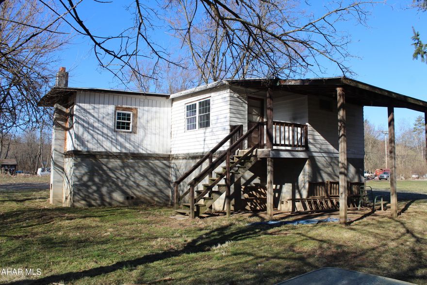 Looking for an investment, a cabin, a home outside of town? Some updates have been made (new windows, plumbing). Still needs a bit of work to be finished. Large bedroom could be split into two. One room could be closed in for another bedroom or used as a dining room. Property is being sold as-is, cash only.

Property is in a floodway. Home is raised. Deed restrictions per the municipality - no new buildings / additions / permanent structures on the property.