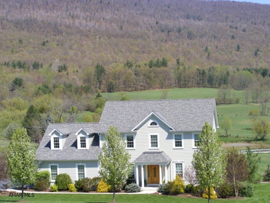 Absolutely lovely custom built home with over 3000 sq. ft of finished living space and magnificent mountain views! Stunning kitchen, oversized granite island, double ovens,custom tile designed pictured framed backsplash, tons of workspace & gorgeous cabinetry. Beautiful stone fireplace in  the family room, Florida Room, Formal dining room w/ hardwoord floors.Great Master bath w/ jucuzzi tub & tile shower.Nice size bedrooms w/lots of closet space.Cozy screened porch, terrific lower patio from walk-out lower level to a beautifully landscaped yard. 4 zoned heating,HardiPlank exterior,solid oak doors & trim..nothing spared in the custom construction of this immaculate and well planned home.