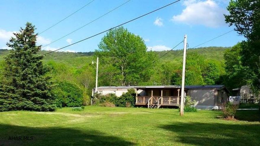 HUNTERS PARADISE or wonderful building site, full-time home or hunting retreat. 9.5 acres of gorgeous views and an abundance of forest and wildlife. Includes two mobile homes, one 12 x 56, two bedroom and one 14 x 70, three bedroom. Also a 10 x 28  carport/pavilion and a 14 x 23 recreational building. Property includes well and septic. All this in a private setting near Pennsylvania's prime retreat locations. Located only 30 minutes to Somerset PA and 1  hour to Pittsburgh or 3 hours to Washington DC area. Only 3 hours from DC and 1.5 hours from Pittsburgh. This is an outdoor paradise.