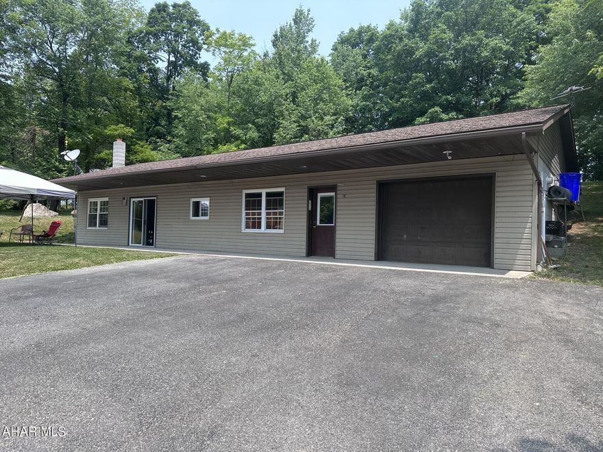 Carrolltown - 25 year old vinyl ranch home on approximately 1 acre on dead-end street. 1 car attached garage. One wall needed to make a second private bedroom with 1/2 bath.  Remainder of floor plan consists of LR with a woodburner, Eat-in kitchen, master BR, full bath, laundry, and open office area.  Oil, hot water radiant heat in the floor with 4-zones including garage floor.  Large shed and appliances included.