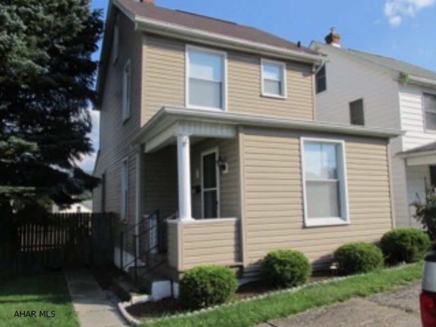 Nice 2 bedroom, 1 bath in a quiet neighborhood with a finished attic for possible 3rd bedroom. All new laminate flooring on 1st and 2nd floors. Off street parking, 1 car garage and large covered back porch.