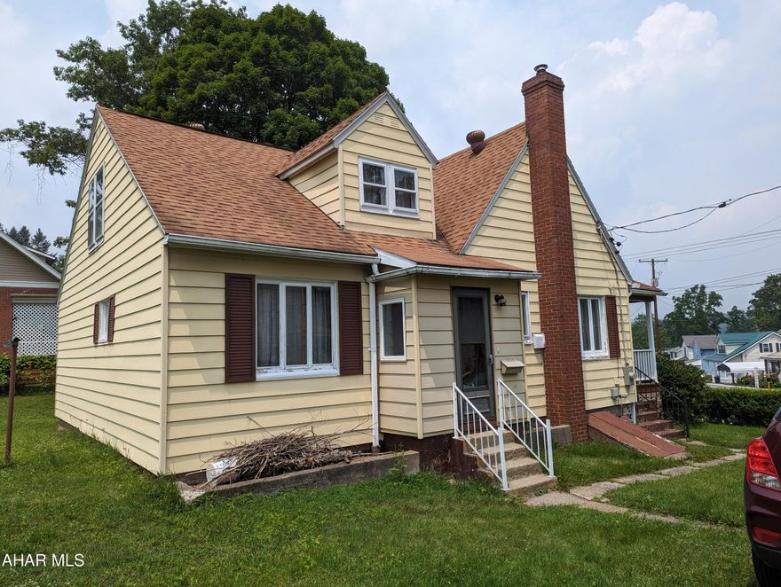 Spacious 4-bedroom home in Nanty Glo borough.  The first floor has a sunroom, living room, dining room, eat-in kitchen, 2 bedrooms, and a full bathroom.  The floors are hardwood in the living room, dining room, and all 4 bedrooms.  The upstairs has 2 bedrooms and a storage room. In the unfinished basement, there is a half bath on one side and a shower on the other.  There is a nice covered porch, a 1-car garage, and a large, flat yard.