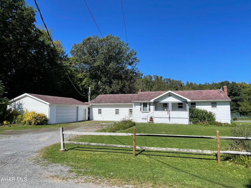 Sitting on a level half acre parcel this freshly painted, spacious home has 4 bedrooms 2 bathrooms and two family living spaces with the opportunity to finish the basement for additional living space. Enter the front door into a spacious living room that is open to the kitchen and dining area making it great for entertaining family and friends! There are three bedrooms and one full bath on this level. If you steps off of the kitchen, you enter a spacious family room that connects to a massive master suite.  The master suite has a sitting area and a walk in closet, spacious bathroom with laundry hook ups.  On the side of the house, there is a walk-in shed that had plumbing to it at one time.  The large garage will keep your vehicles snow free this winter.  Call to set up a showing.