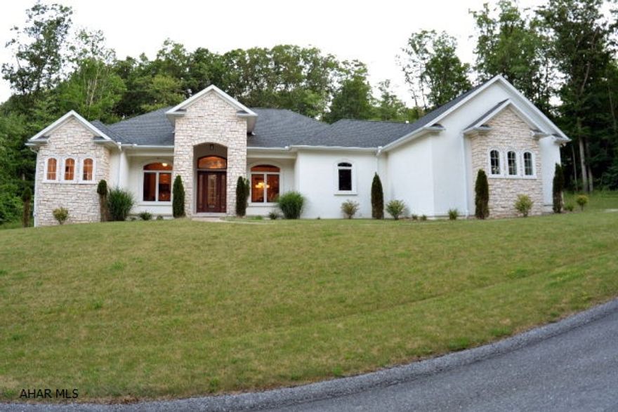 One of a kind. Flowing floor plan, 3 sided fireplace, cherry, ceramic, granite counter tops. Each bedroom has a private bathroom. Total quality, A Must See! Huge garage situated on over a 3 acre private setting.