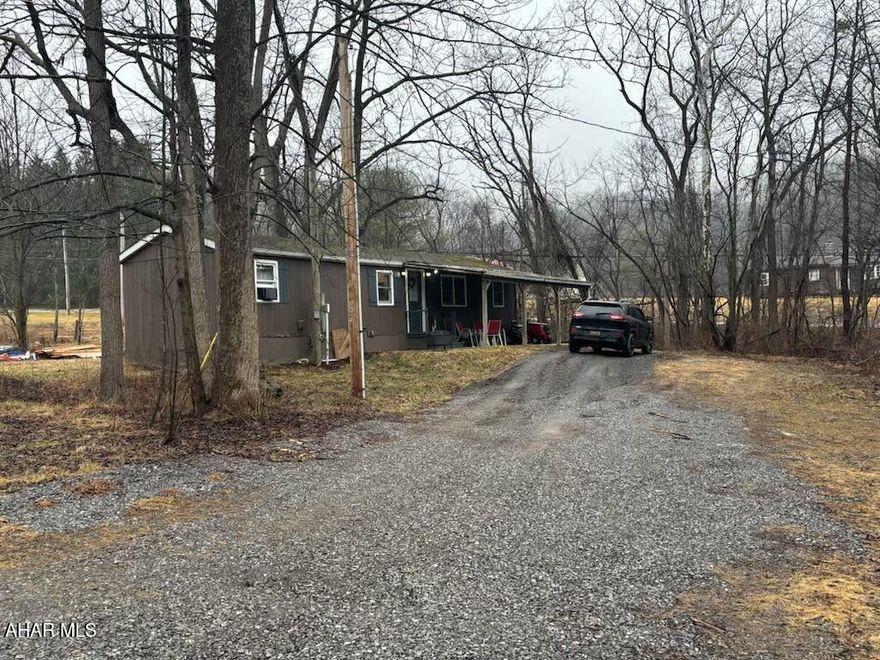 Looking for your own getaway near the lake? This property offers a great opportunity to enjoy everything the Raystown area has to offer while also generating income.

Conveniently located close to Raystown Lake, this property features an income-generating trailer already on site, making it a great investment or personal retreat. The lot is equipped with two wells and two septic systems, providing flexibility for additional use.

There's plenty of space to add your own camper or another trailer, making it ideal for hosting family and friends or expanding your rental potential. The property is also just minutes from the Aitch Boat Launch and a short drive to Seven Points Recreation Area, putting boating, fishing, and outdoor recreation right at your fingertips.

Why rent a campground lot every year when you can own your own piece of property near the lake? With room to park your boat and enjoy the outdoors, this is the perfect spot for weekend escapes, vacation use, or rental income.

Don't miss this opportunity to own your own Raystown Lake retreat!