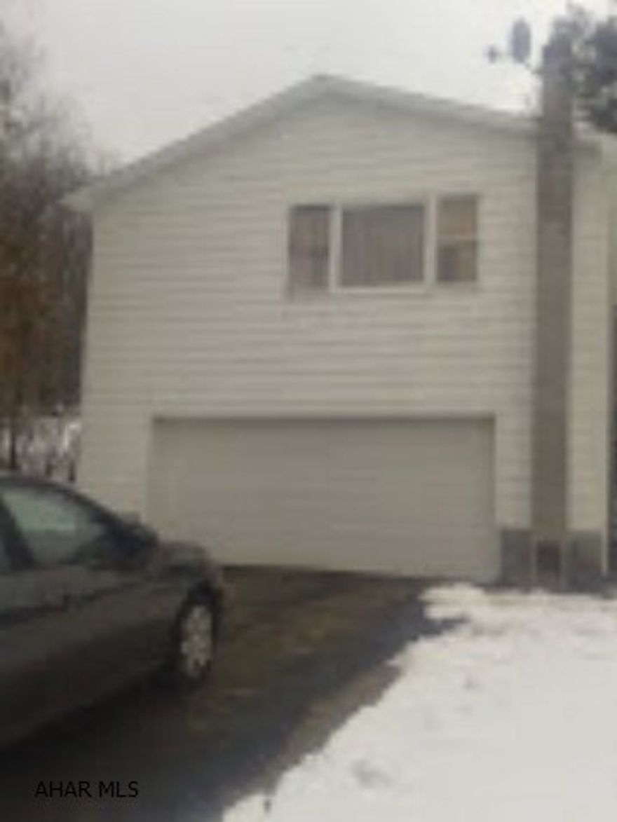 Price dramatically reduced motivated seller. This raised ranch built on 1979 is secluded but has easy access to Rt 22.  The house features oak kitchen cabinets, a propane woodstove, a concrete patio located under the deck that has a retractable awning and a paved driveway. There is a second well and sewer on the site.