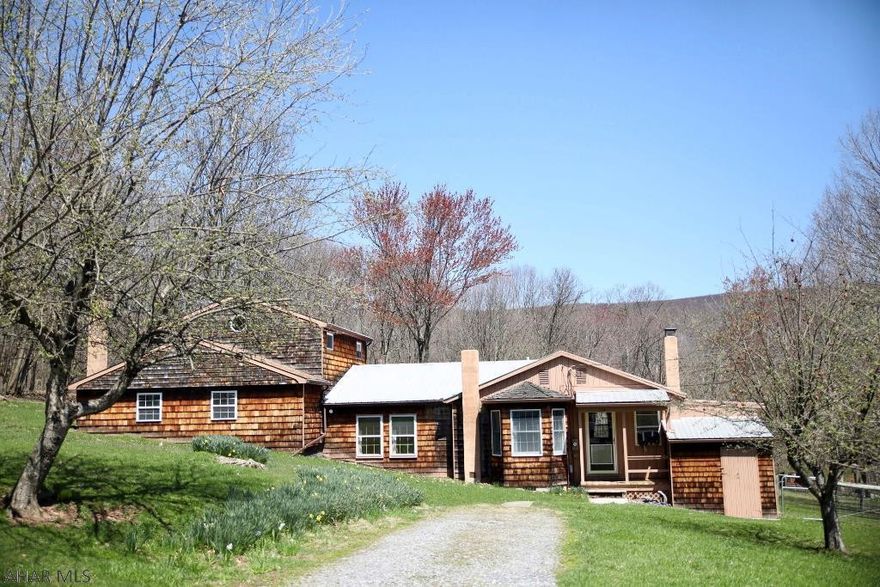 Private and serene location on 62+ acres. Well maintained home offers one floor living plus a large second story (private entrance) with bedroom and bath. Combo heating, attached and extra deep garage, large barn with electric. Close to Breezewood, PA and Bedford City line, PA Turnpike and I-70.