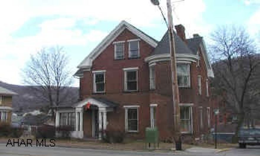 2 1/2 Story Brick duplex.  2 bedroom apartment on each floor.  2 furnaces, 2 electric services.  Vacant.