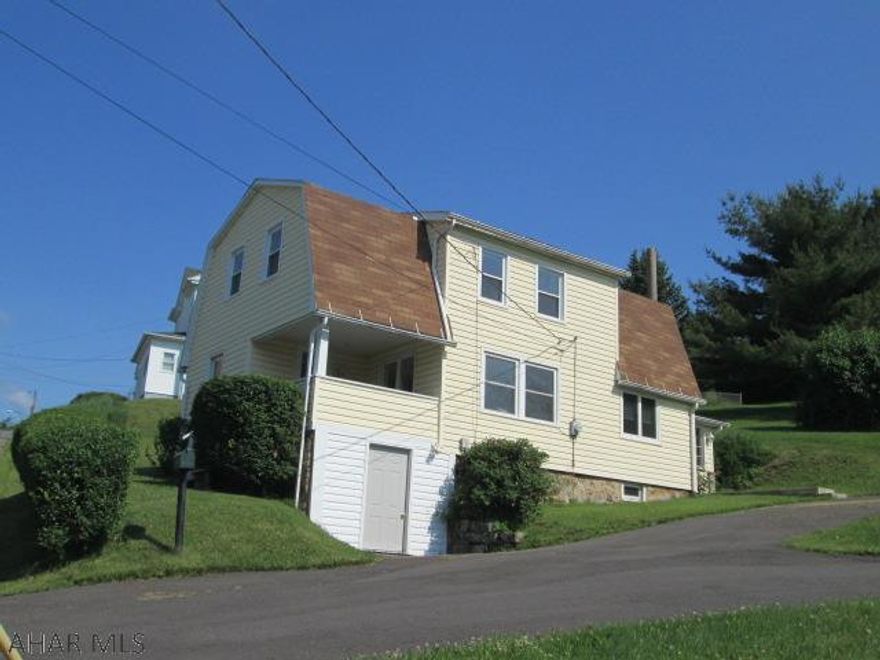 Tyrone Borough. If you desire a quiet and peaceful setting this is it. Large eat in kitchen features oak cabinets, fridge, range and laundry area. Large living room has beautiful view of the mountains. Convenience of 1st fl bath is a plus. Check out the enclosed rear porch which could be a sun room. Basement features workbench & walkout.