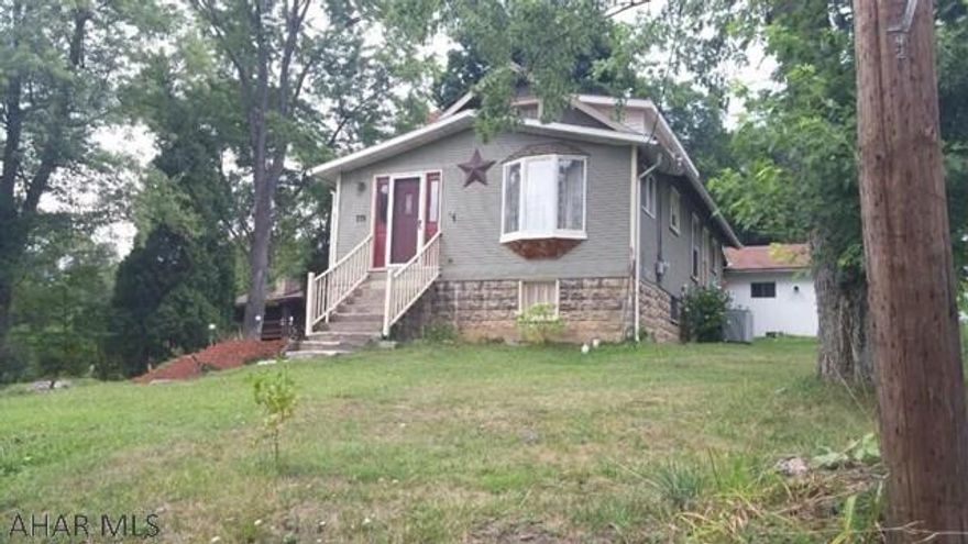 Walk to the Altoona Ball park from this 2 bedroom home that sits on over an acre of ground! This home is just minutes from I99 and Logan Town Center. The living room is large and offers a vaulted area and bay front window, the dining room is a great place to entertain family and friends. The main floor bedroom and full bath make for easy 1 floor living, there is a 2nd bedroom with nice closet space on the upper floor. Lots of storage in the full unfinished basement. The 2 car detached garage will keep your vehicles protected from the weather or is a great place for extra storage.