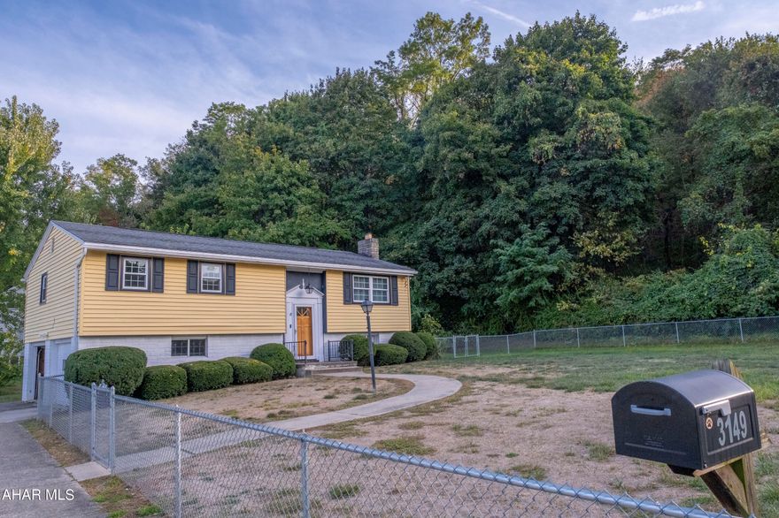 OPEN HOUSE Sunday September 22nd from 10:00-11:30 am! 
MOTIVATED SELLERS!!  Bi-level home located on an AMAZING lot in the City of Altoona! This home features a huge fenced in front yard with ample parking and yard space. Inside you will find a spacious living area right off of the kitchen and dining room. The kitchen has plenty of cabinets for storage and an eat in bar. Off of the kitchen you will find a sunroom, a perfect place to enjoy your coffee on these chilly fall mornings. Access to the back yard and an additional storage area are off of the sunroom. Two bedrooms and a full bath complete the upstairs area. Downstairs there is a cozy family room with a propane fireplace. Utility room and access to the back yard are downstairs as well. Two car HEATED garage and a large shed make for even more storage and parking! Dont miss out!!