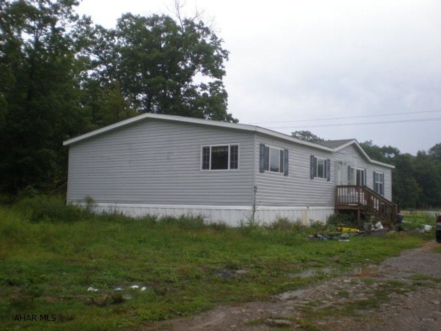 Doublewide on 63.093 acres. 3-BR, 2-BA.