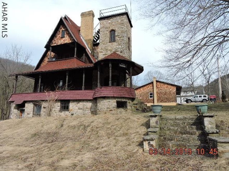 Rare opportunity  to own a piece of Blair County history.  This home was built by State Senator Plymouth Snyder for his summer residence known  as Cottage Rundschau.  Located in Point View Cottage Assoc, the Planned Community offers hunting & hiking to its residents on approx 207 acres. $100/mo fees cover rd maintenance, common ground maintenance & sewage.  This home has many original appointments & is begging to be restored to its original glory.  Original doors & woodwork.  Views from the turret are stunning though enter at your own risk. Modern 3 car garage has a finished heated basement + 1 car gar included with hoa  Point View Cottages has a very interesting Facebook page.  Check it out:  https://www.facebook.com/PointViewCottages/?rf=952573394825603