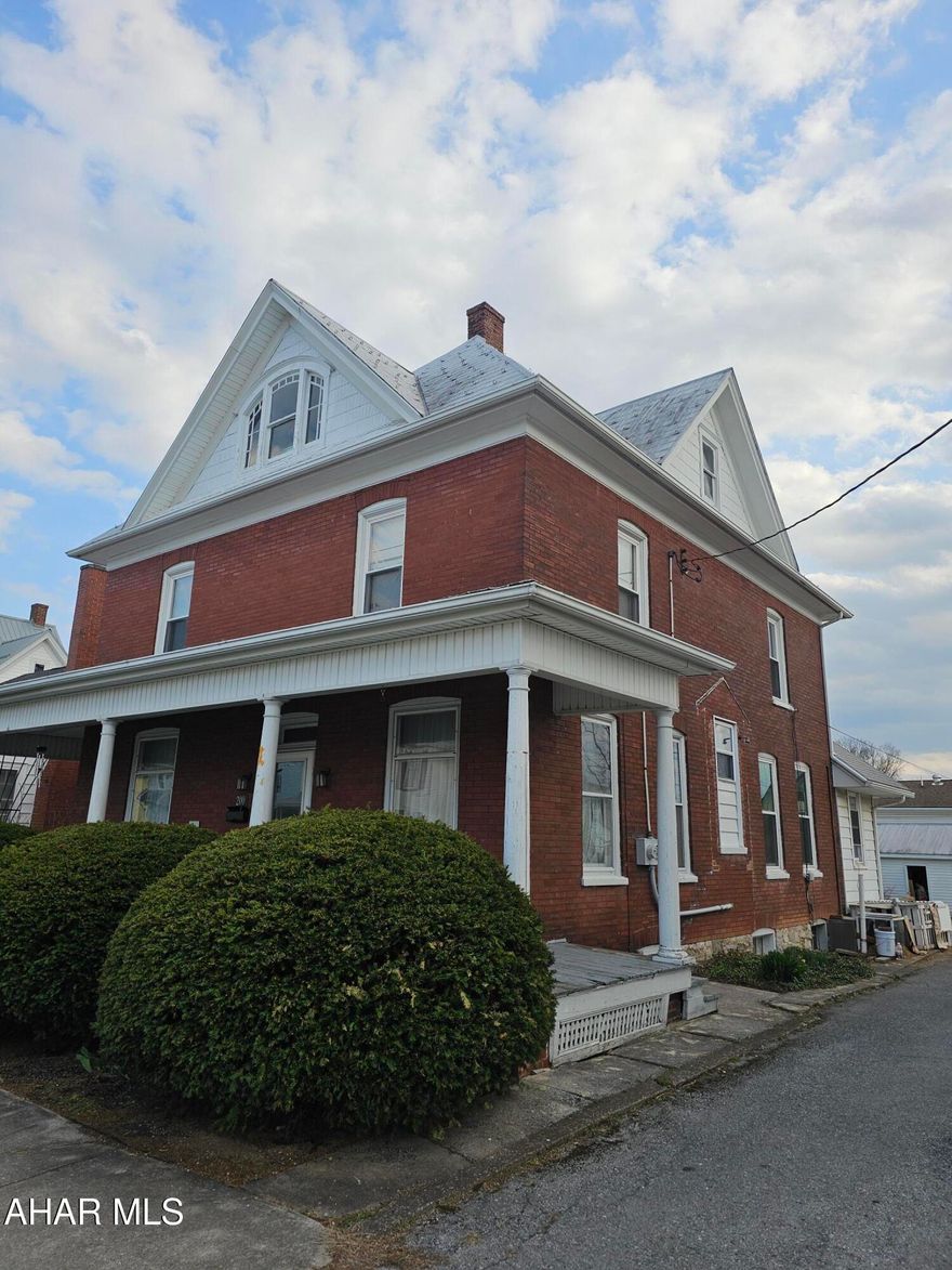 Original wood work and beauty with a HUGE modern kitchen with Island and butcher block countertops and LARGE bedrooms. This home has a ton of space and charm. Large clean unfinished attic with such old world charm. All original woodwork and pocket doors! One car garage and off street parking. Brick exterior in a walkable community in the middle of town! Come see for yourself!