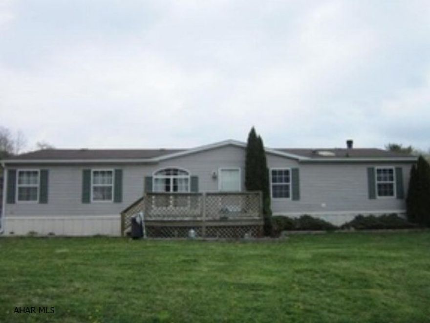 New carpet, nice sized rooms, bonus family room with real wood burning fireplace. Detached 2 car garage on a half acre lot.