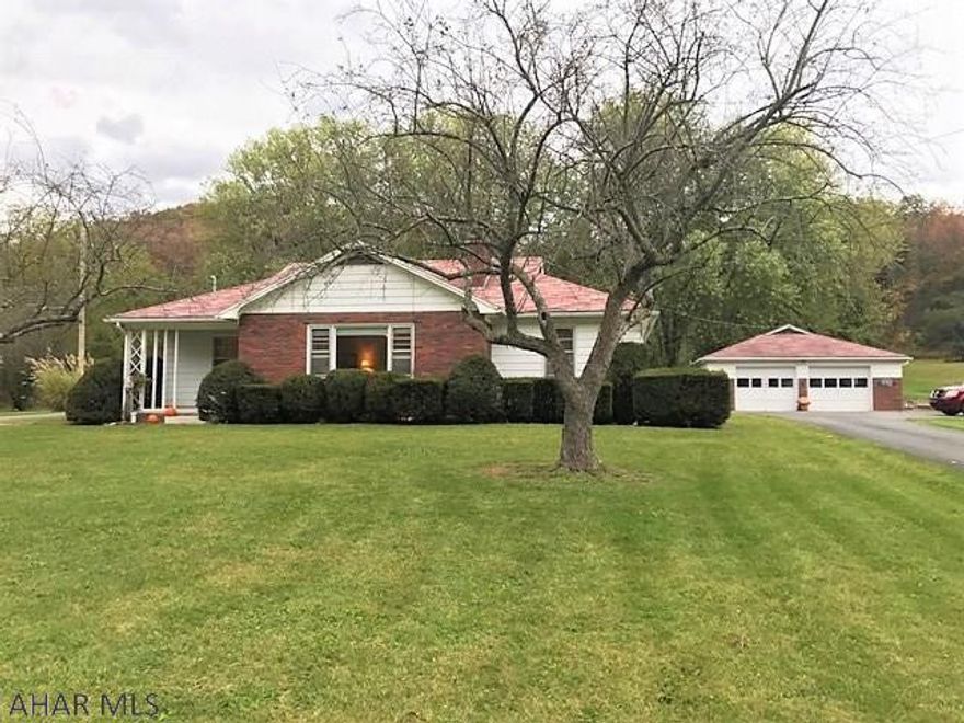 This is a well maintained and well constructed ranch home!! It features a large living room w/ picture window and stone fireplace w/ wood burner insert, dining room with built-in corner cabinet, kitchen, 3-bedrooms (including master w/ bath) & two baths.  Full basement that is finished w/ a big rec room, family room w/ fireplace & laundry room w/ walk-up to exterior. Updated oil hot water boiler, updated 200-amp electric, well & public sewer. Spacious 1.15 acre yard, over sized 2-car detached garage & black top driveway. Front covered porch, 14' x 48' rear covered flag stone patio & outdoor brick stove. Conveniently located to State Game Lands, H&BT Rails to Trails and a short drive to Raystown Lake!